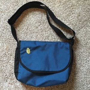 Over the shoulder bag for books.
